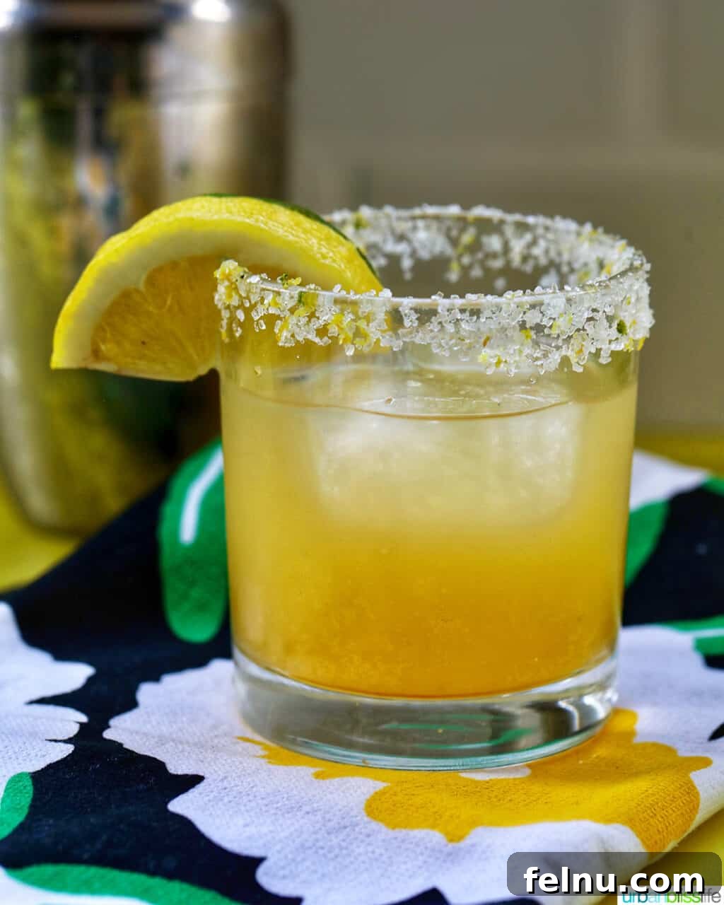 Zesty Yuzu Margarita 7 A beautifully presented glass of Yuzu Margarita with lemon and lime slices, artfully placed on colorful napkins, capturing the essence of summer.