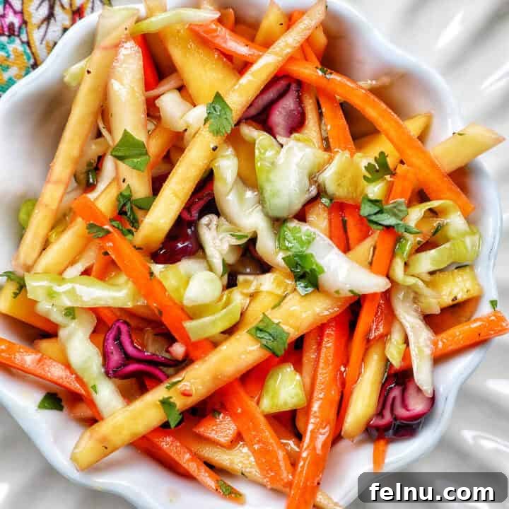 Mango slaw with cabbage, carrots, red bell pepper, mango.
