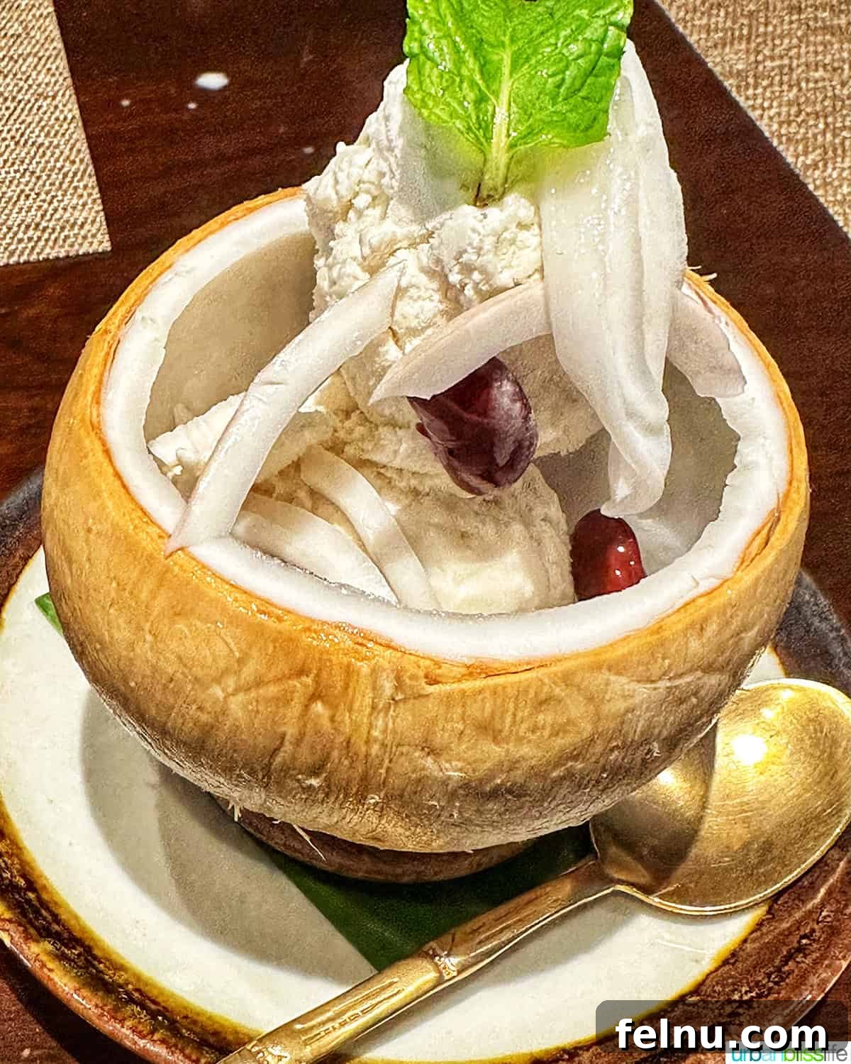 Must-Try Thai Dishes 25 Coconut cream dessert at Jim Thompson House Thai restaurant in Bangkok, Thailand.