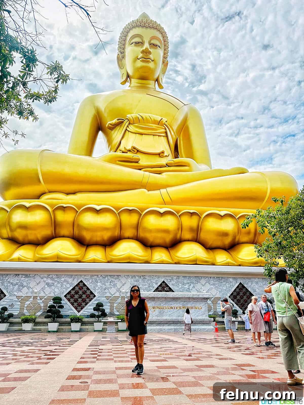Must-Try Thai Dishes 4 Marlynn Jayme Schotland in front of the big gold buddha in Bangkok Thailand.
