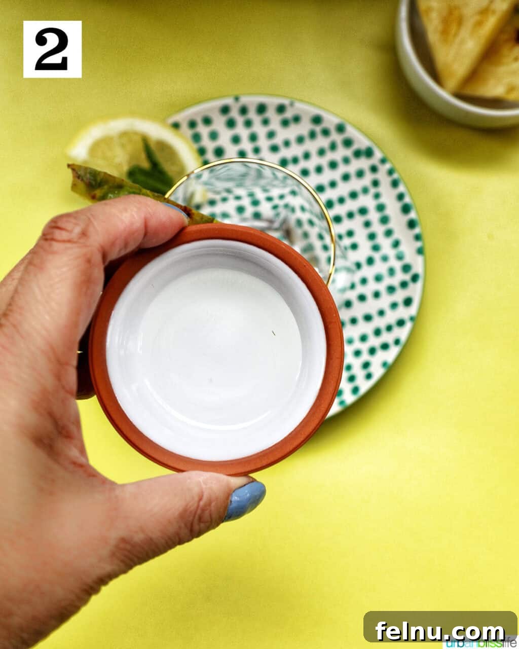 Adding simple syrup to the glass.