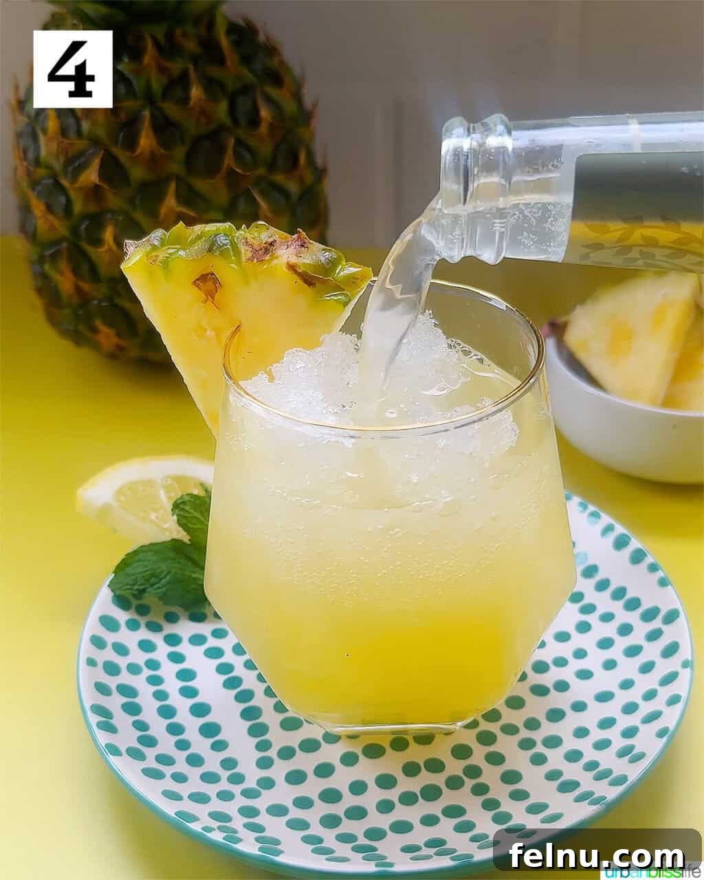 Pouring ginger beer into the glass.