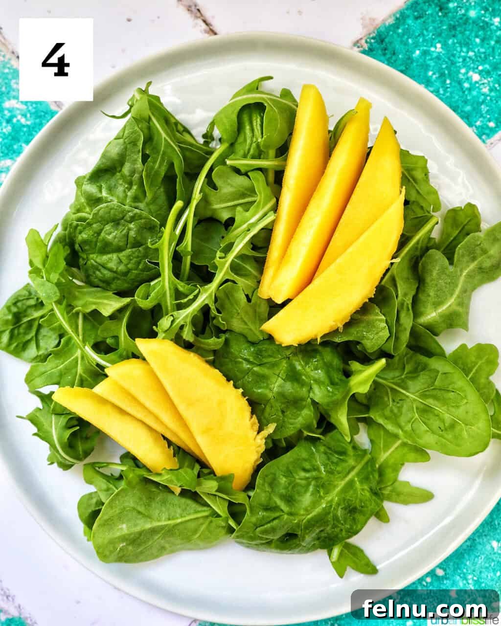 Mango Avocado Shrimp Salad 8 The mixed greens topped with slices of juicy mango