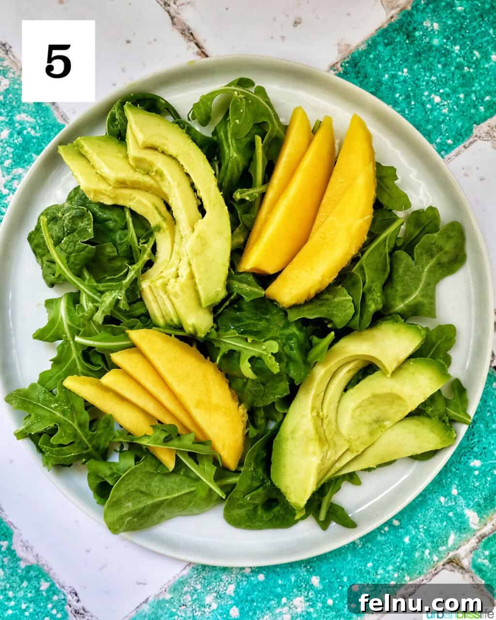 Mango Avocado Shrimp Salad 9 Mango and mixed greens now accompanied by creamy avocado slices
