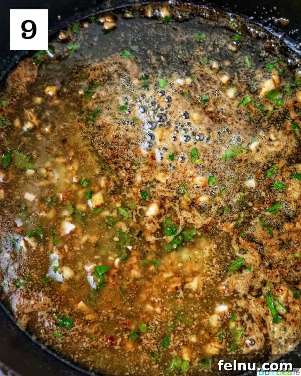 Butter, garlic, herb sauce in a cast iron skillet.