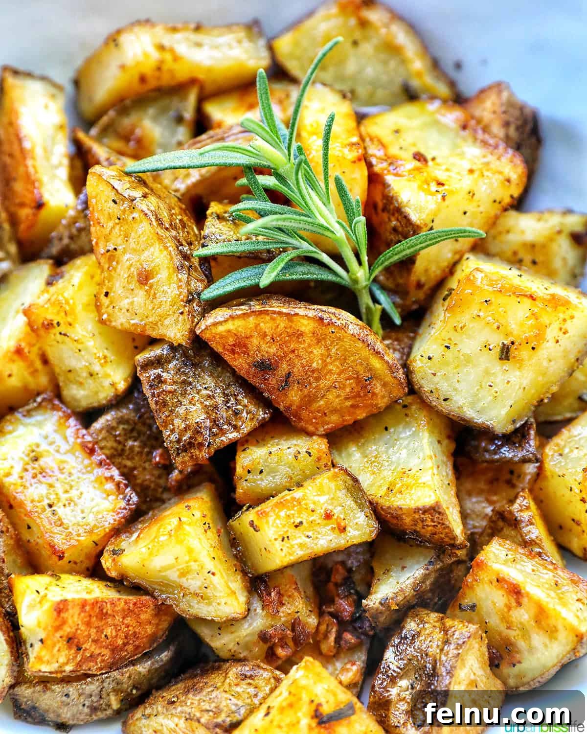 Crispy Rosemary Garlic Potatoes 2 rosemary and garlic roasted potatoes.