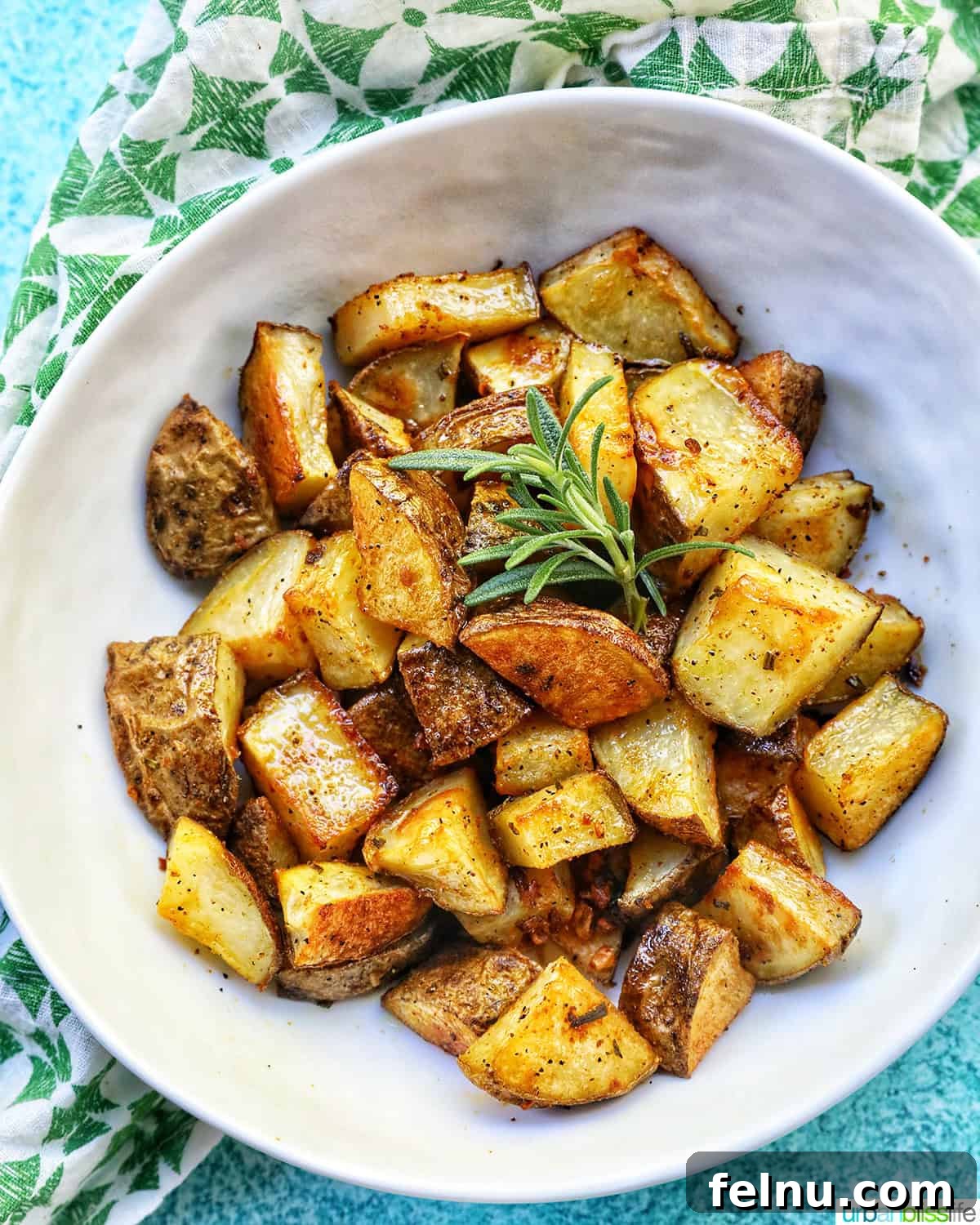 Crispy Rosemary Garlic Potatoes 3 bowl of rosemary and garlic roasted potatoes.