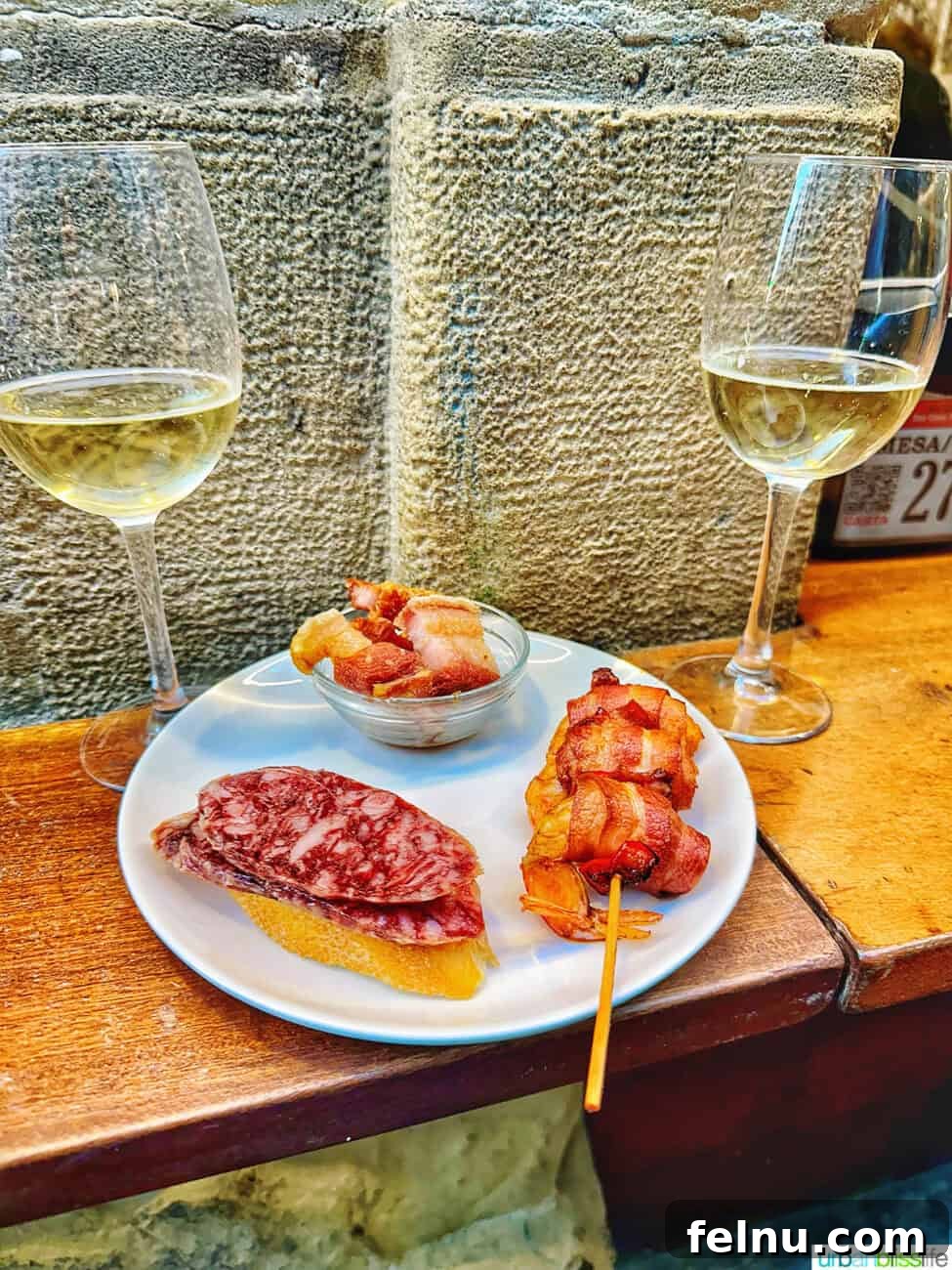 Savoring San Sebastian's Finest Pintxos 11 Glasses of wine and a plate of pintxos, symbolizing the perfect pairing in San Sebastian.