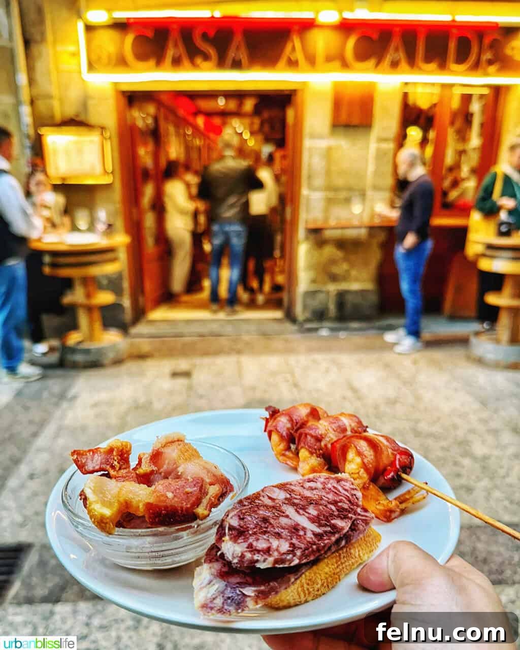 Savoring San Sebastian's Finest Pintxos 12 A person holding a plate of delicious pintxos, ready to enjoy the San Sebastian culinary scene.