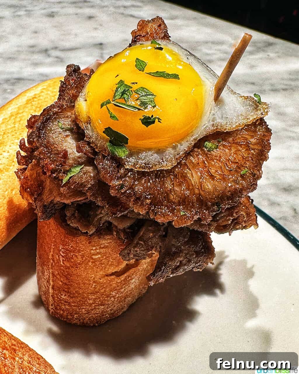 Savoring San Sebastian's Finest Pintxos 16 A beautifully presented pintxo with an egg, possibly symbolizing a gourmet touch.