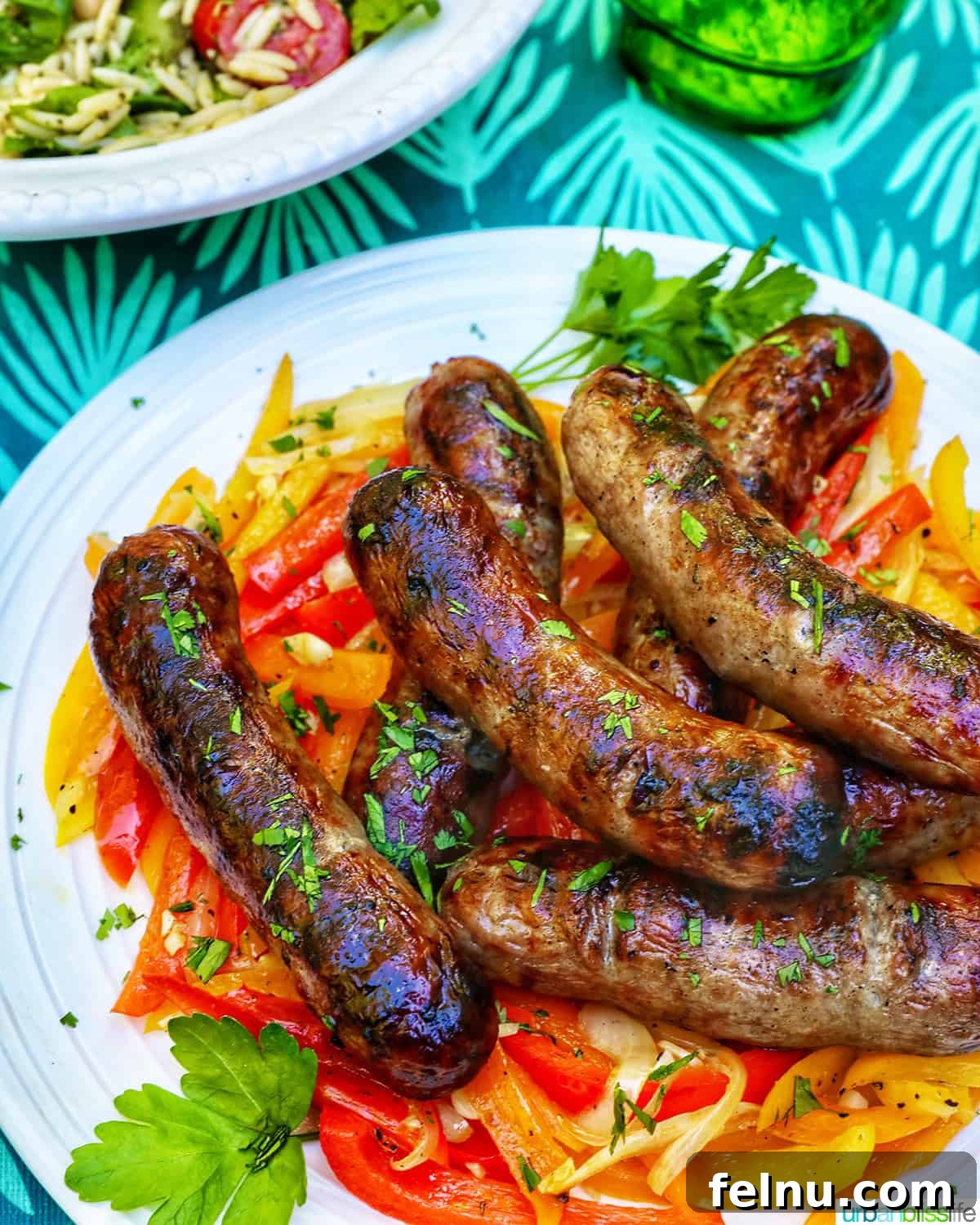 Grilled Bratwurst Bliss 3 Bowl of grilled bratwurst over sauteed peppers