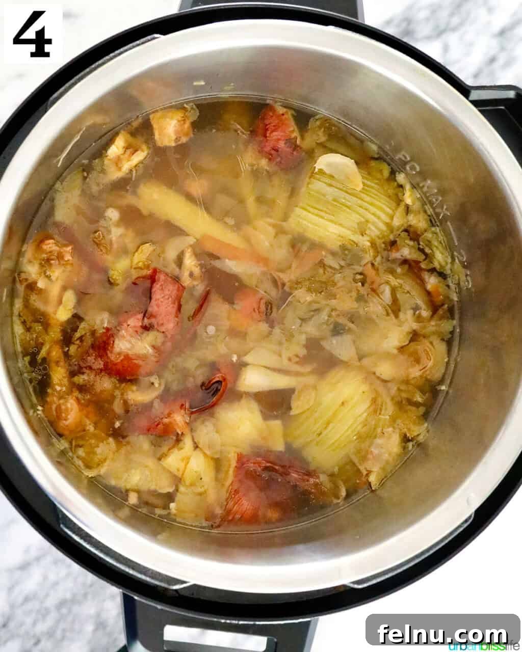 Chicken bones and vegetable scraps cooked in an Instant Pot