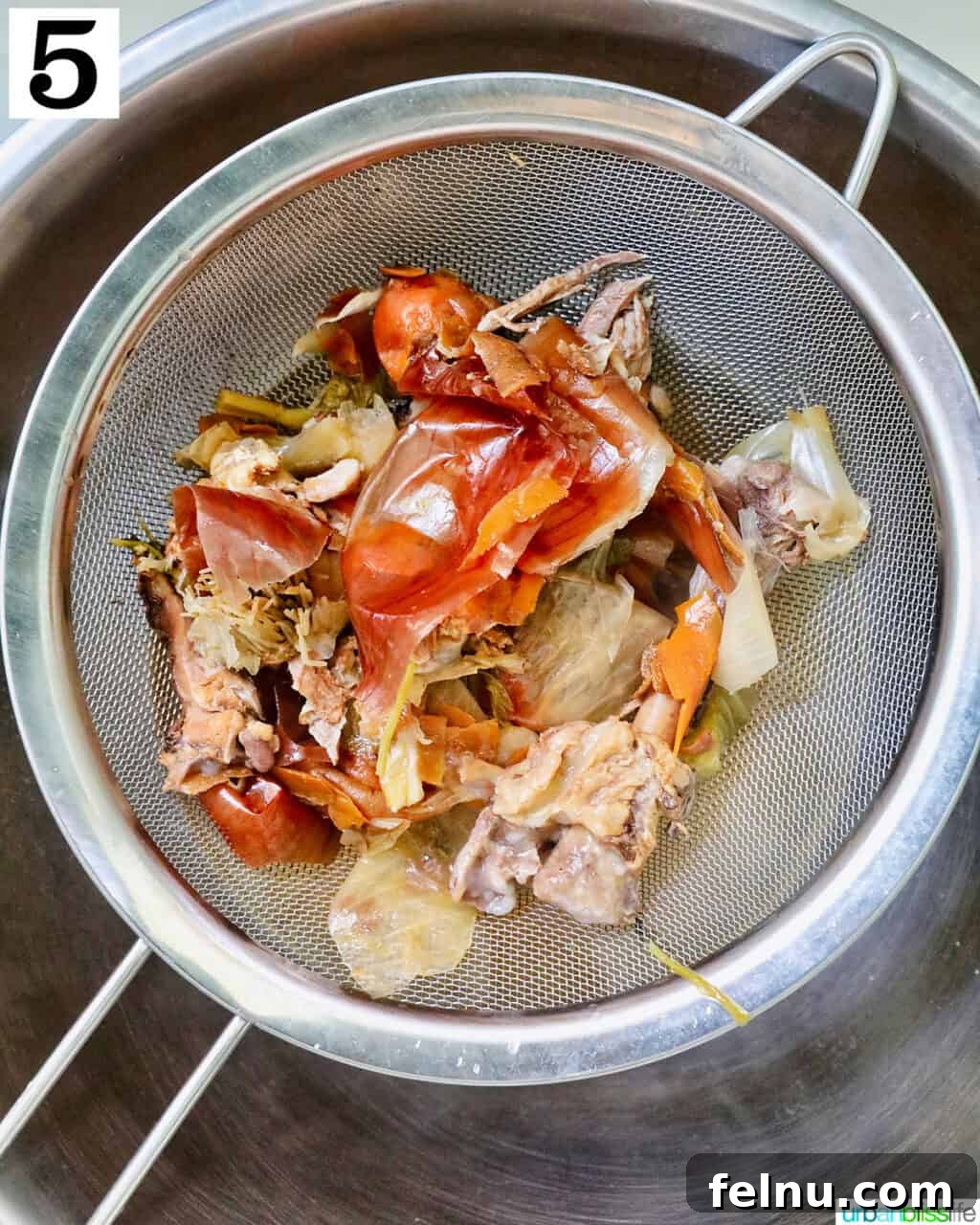 Straining chicken stock