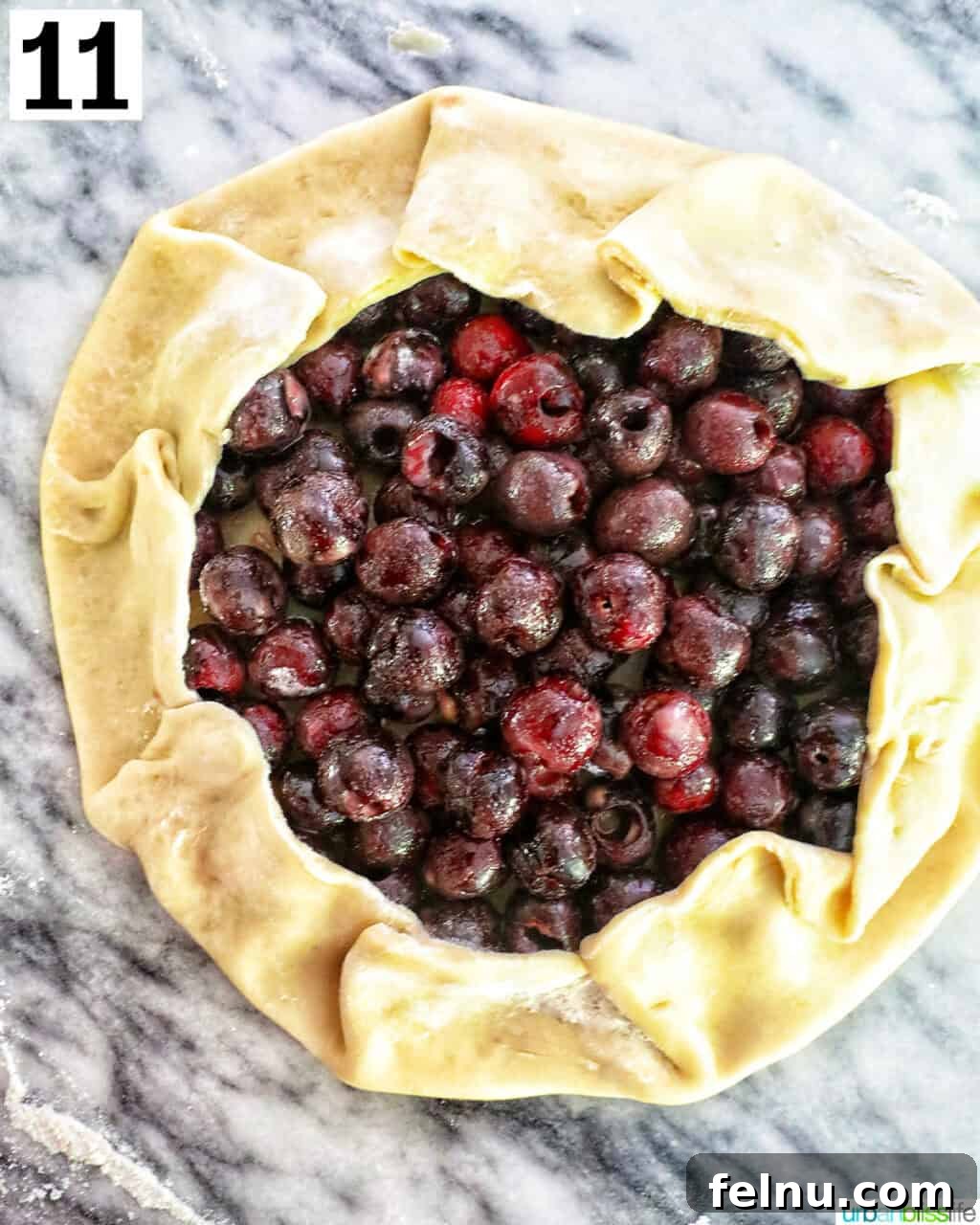 Unbaked cherry galette on a counter