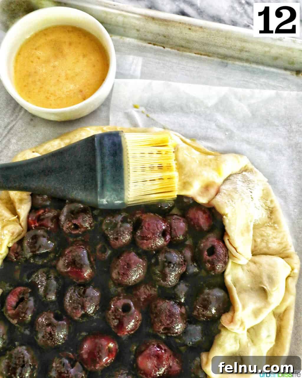 Cherry Bliss Galette 16 Brushing egg wash on the edges of the dough