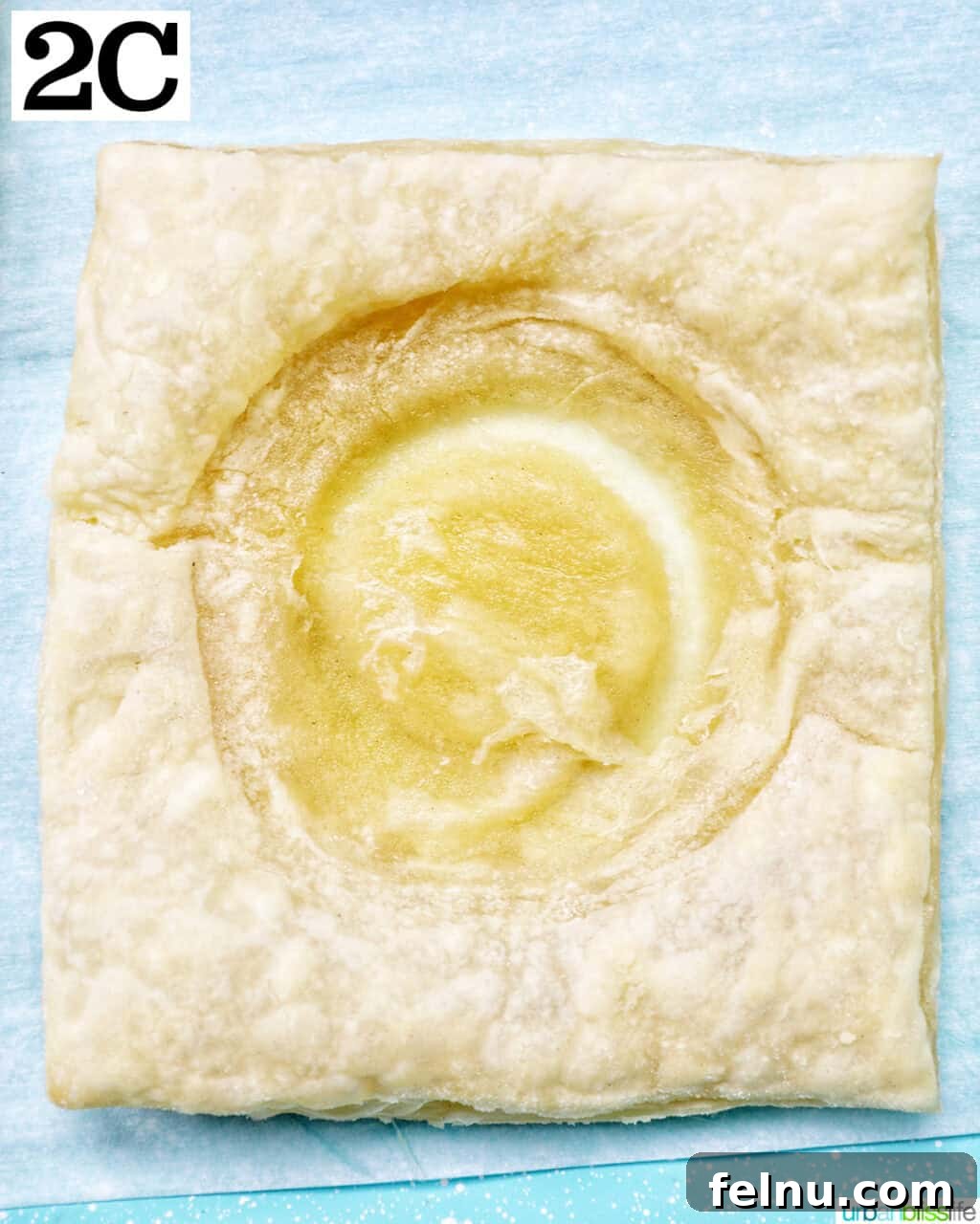 Golden Egg Parcels 8 Puff pastry square with a circular indentation in the middle, ready for filling.