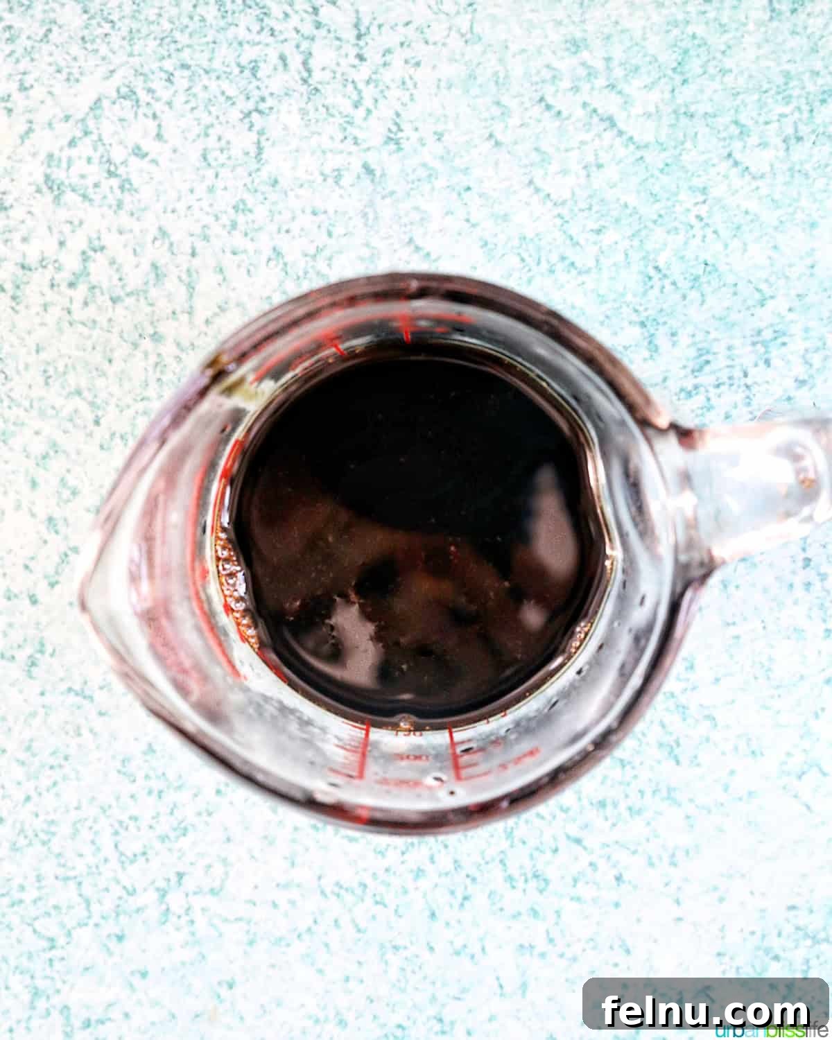 Crafting the Perfect Balsamic Reduction 3 Measuring cup of balsamic glaze.