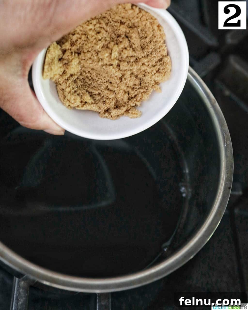 Crafting the Perfect Balsamic Reduction 5 Bowl of brown sugar over a saucepan of balsamic vinegar.