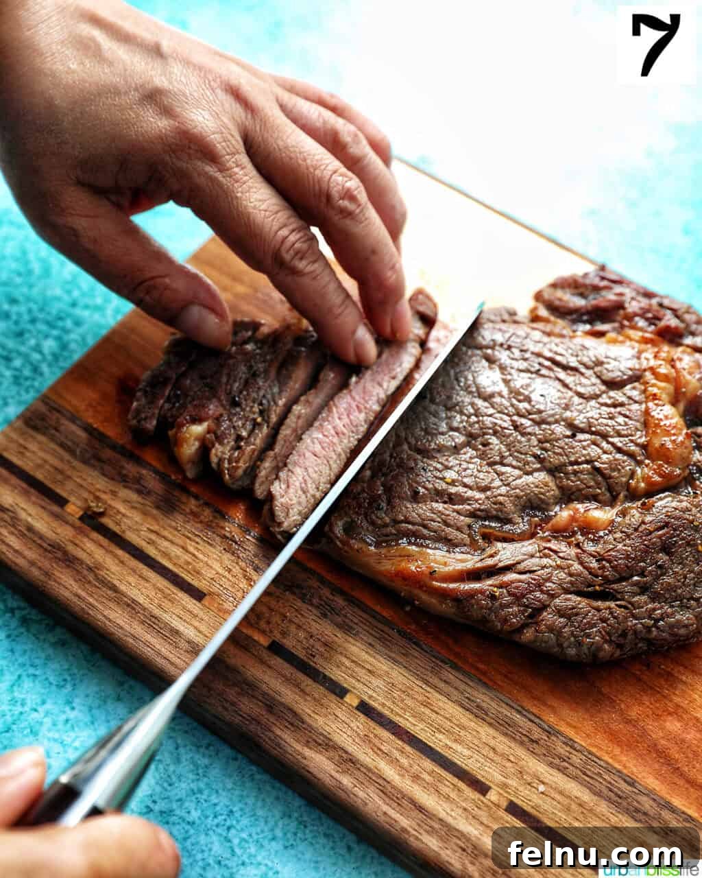 Steak Bites on Toasted Bread 13 Slicing steak on a cutting board
