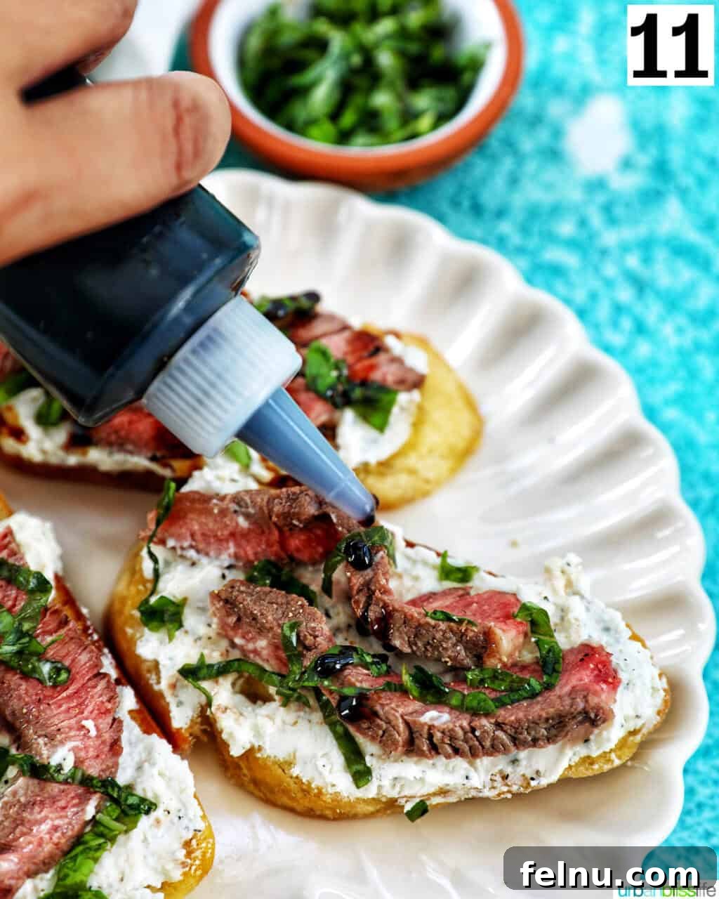 Steak Bites on Toasted Bread 17 Drizzling balsamic glaze onto steak crostini