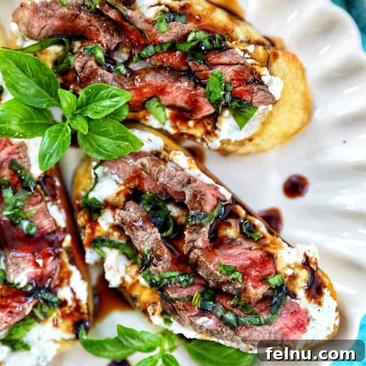 Steak crostini with fresh basil leaves