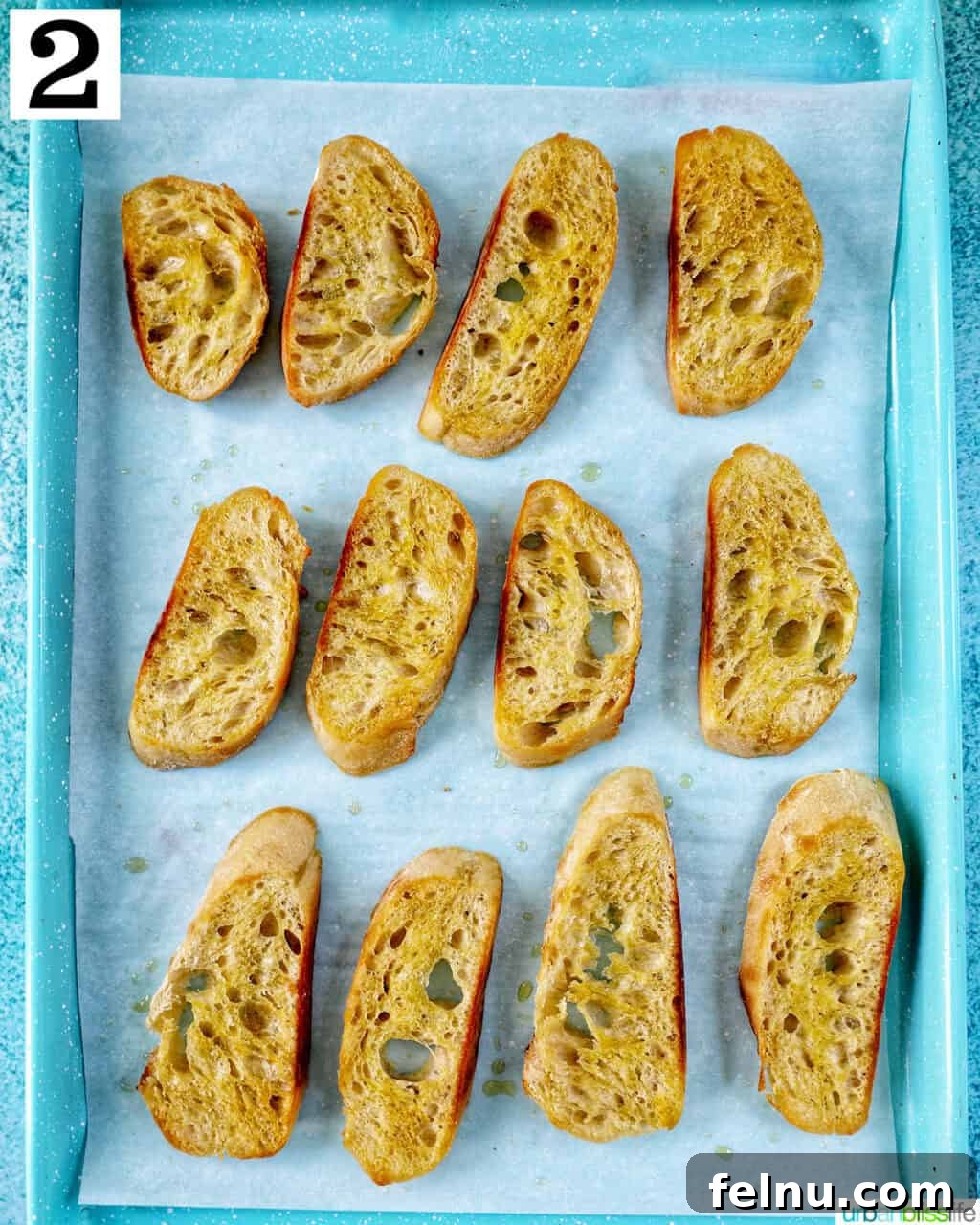 Steak Bites on Toasted Bread 6 Baguette slices on a baking sheet