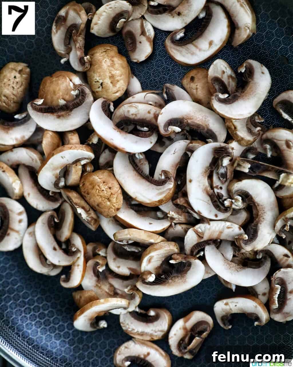 Savory Mushroom Toasts 11 Sliced baby bella mushrooms added to a hot cast iron skillet with olive oil.