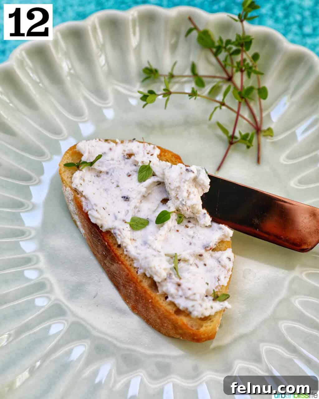 Savory Mushroom Toasts 16 Herbed goat cheese spread evenly on a toasted baguette slice with a small knife.
