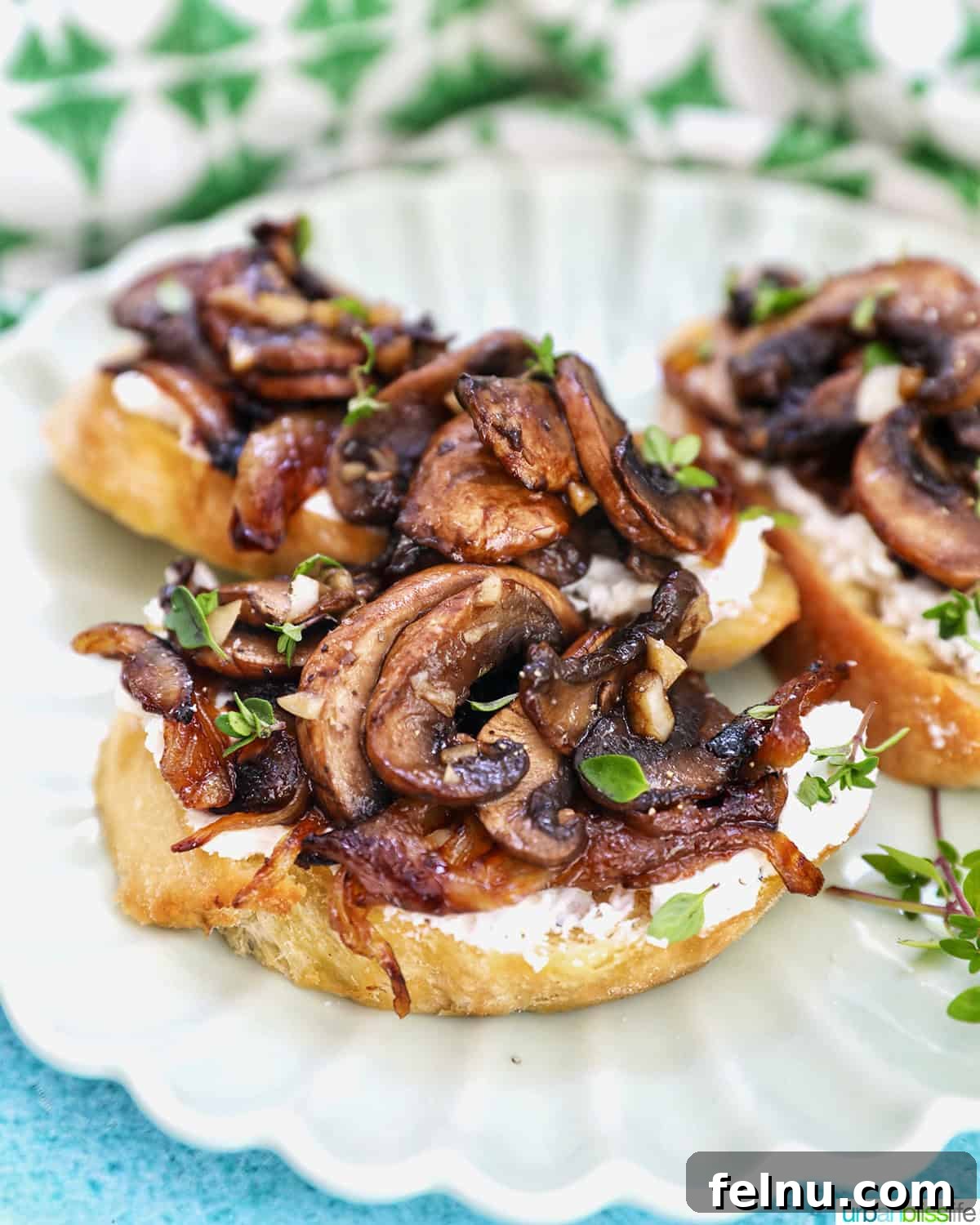Savory Mushroom Toasts 19 Three perfectly plated mushroom crostini, garnished with fresh herbs, ready to be enjoyed.