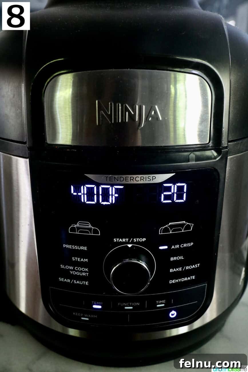 Crispy Air-Fried Smashed Potatoes 14 An air fryer display showing the device set to air fry at 400 degrees Fahrenheit for 20 minutes.