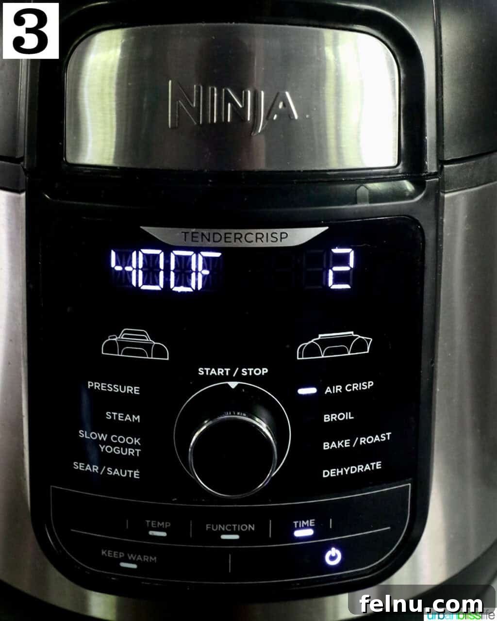 Crispy Air-Fried Smashed Potatoes 8 An air fryer display showing the device set to air fry at 400 degrees Fahrenheit for 2 minutes, indicating preheating.