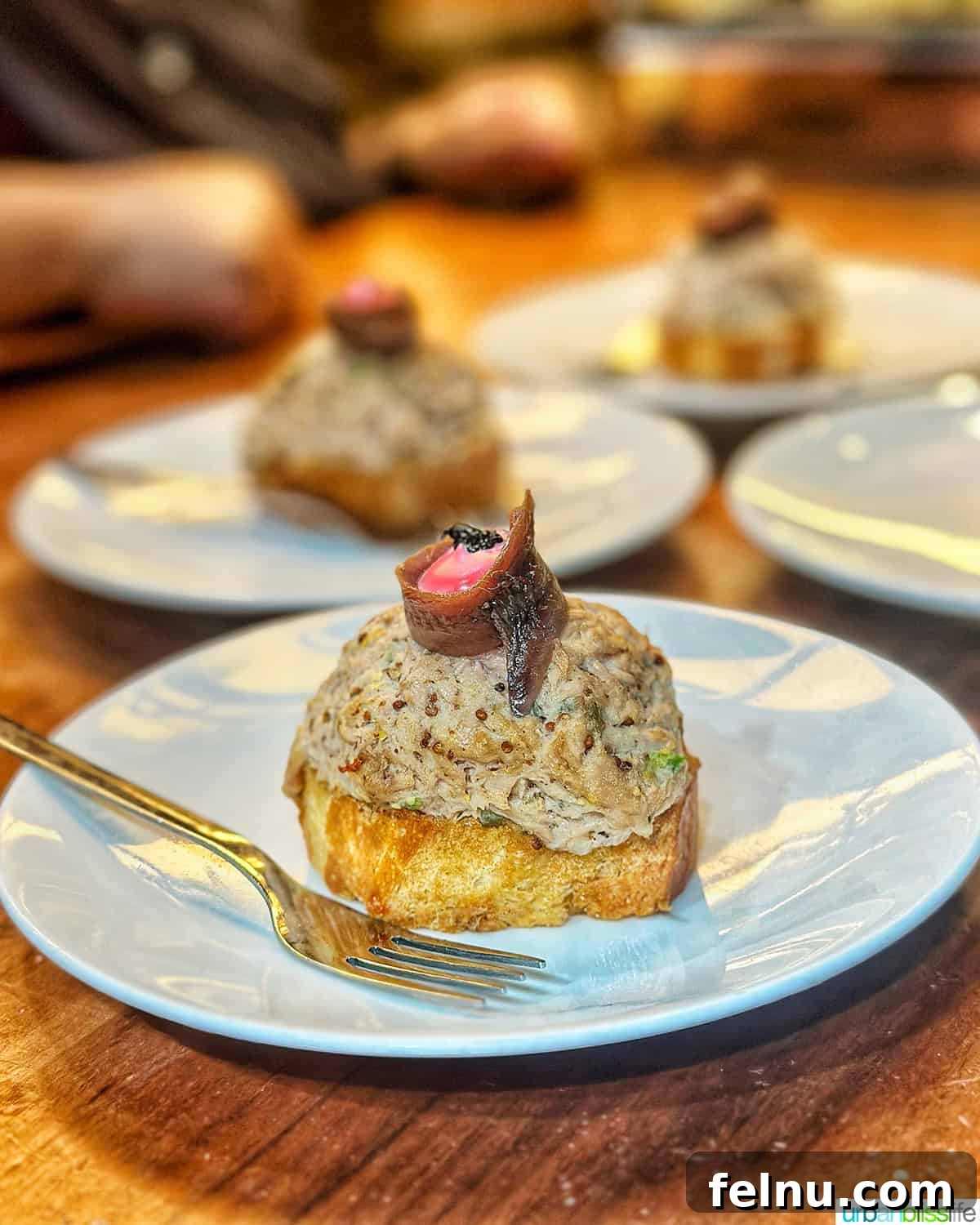 12 Essential Pintxos to Taste 15 Txangurro pintxos, showcasing the delicious spider crab preparation at Toma y Daka restaurant in Bilbao, Spain.