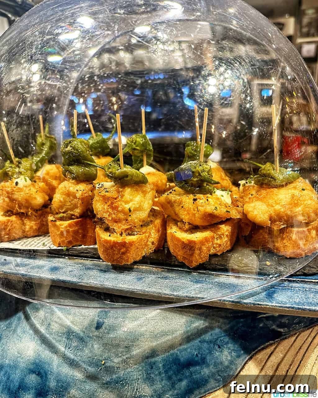 The Ultimate Pintxo Crawl: Bilbao's Best Bites 12 An array of colorful pintxos on bread at La Olla restaurant in Bilbao, highlighting the restaurant's diverse culinary offerings.