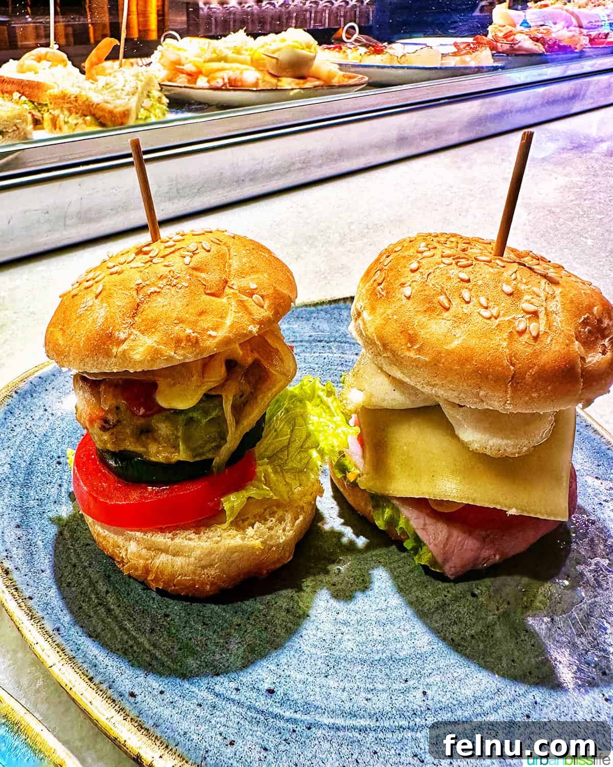 The Ultimate Pintxo Crawl: Bilbao's Best Bites 15 Mini beef burgers pintxos at Abando restaurant in Bilbao, a satisfying and flavorful bite.
