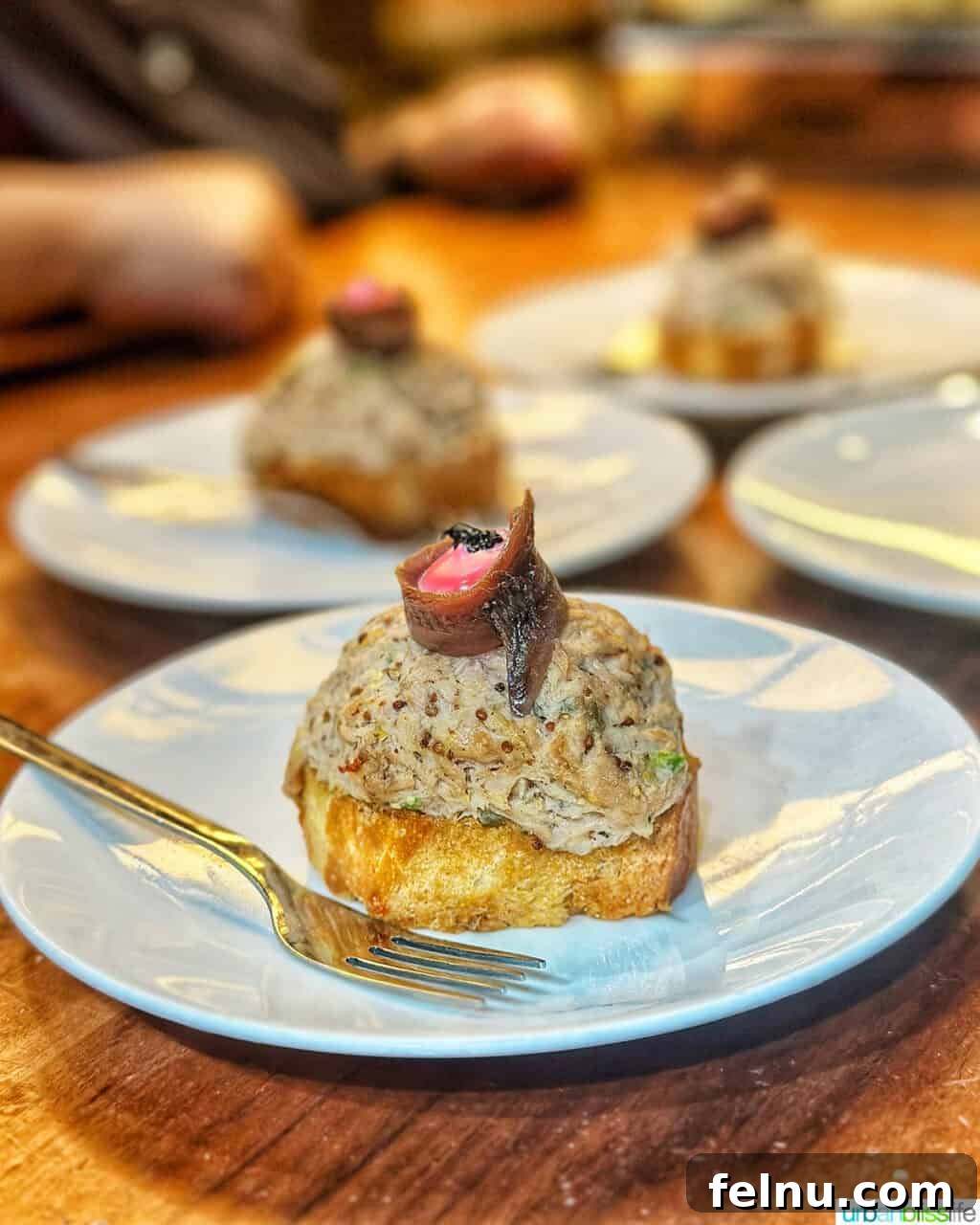 The Ultimate Pintxo Crawl: Bilbao's Best Bites 7 A close-up of Txangurro (spider crab) pintxos at Toma Y Daka, showcasing the rich and flavorful filling.