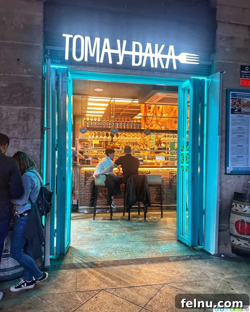 The Ultimate Pintxo Crawl: Bilbao's Best Bites 8 The exterior of Toma y Daka restaurant in Bilbao, showcasing its location in the vibrant Plaza Nueva.