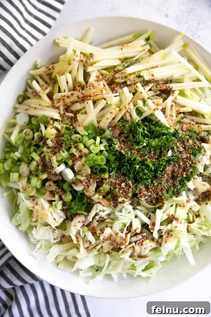 Crunchy apple coleslaw with shredded cabbage and green onions