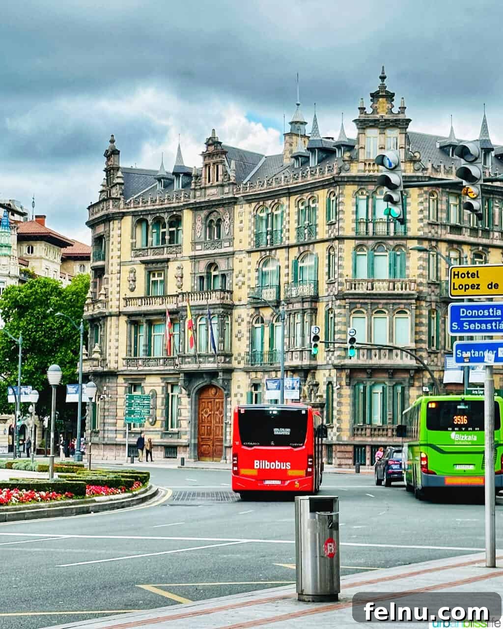 Bilbao Unveiled: Exploring Spain's Basque Masterpiece 14 A historic, ornate building facade on Gran Vía in Bilbao, Spain, showcasing intricate architectural details.