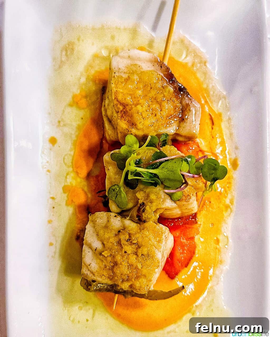 Bilbao Unveiled: Exploring Spain's Basque Masterpiece 20 Exquisite Bacalao a la Vizcaína, a traditional Basque cod dish, served at Los Fueros restaurant.