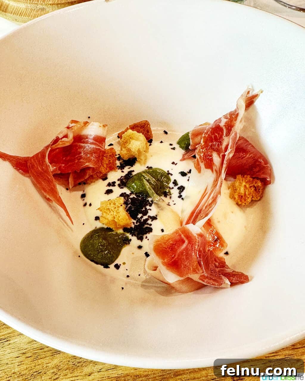 Bilbao Unveiled: Exploring Spain's Basque Masterpiece 29 A beautifully composed main course dish, showcasing fresh ingredients and elegant presentation, from the Guggenheim Museum restaurant.