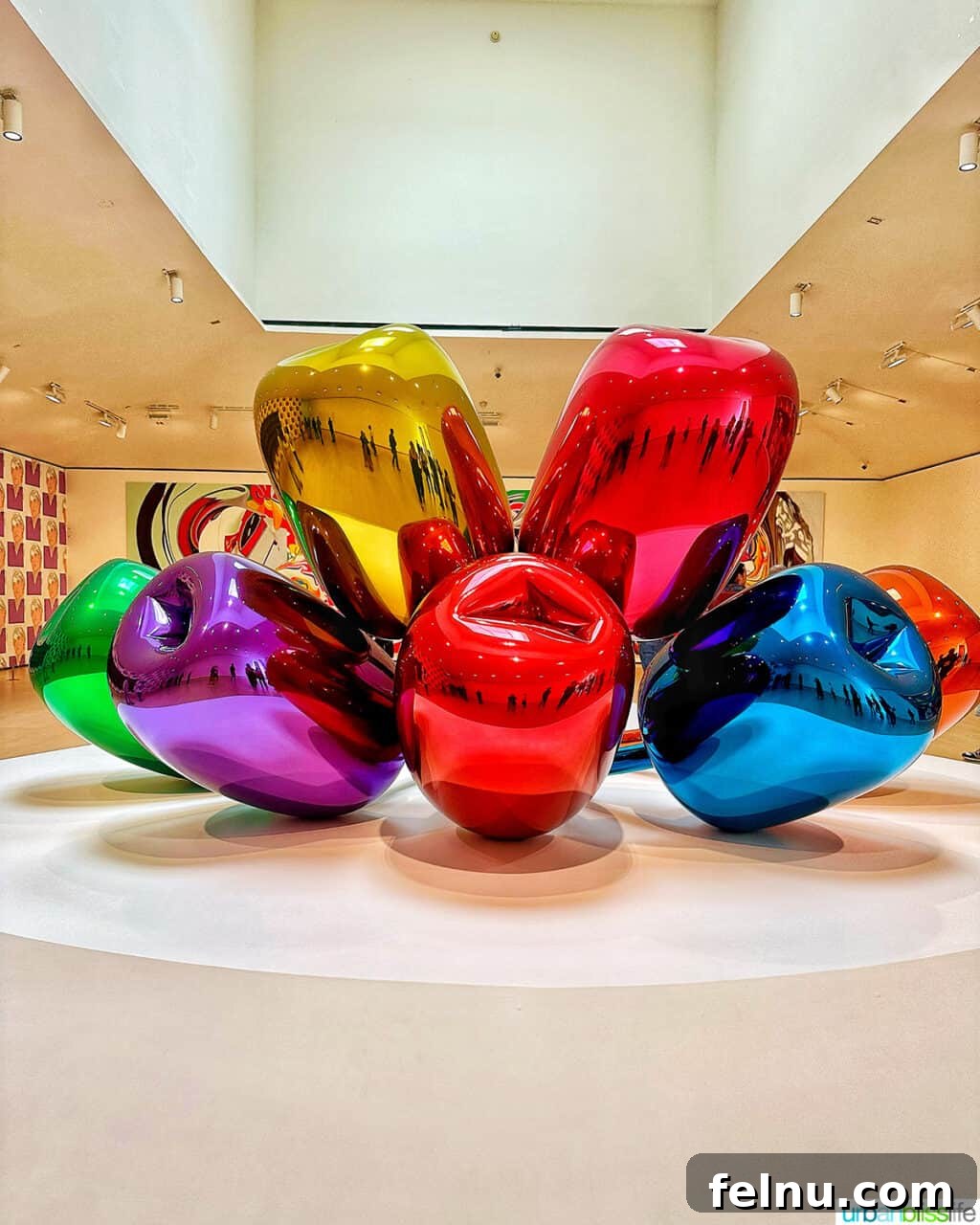 Bilbao Unveiled: Exploring Spain's Basque Masterpiece 6 Jeff Koons' TULIPS sculpture, a vibrant and playful arrangement of stainless steel tulips, displayed within the Guggenheim Museum Bilbao.