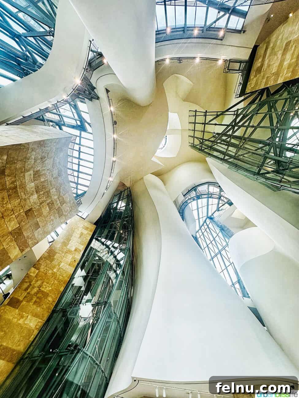 Bilbao Unveiled: Exploring Spain's Basque Masterpiece 9 Intricate and dynamic architecture inside the Guggenheim Museum Bilbao, showcasing Gehry's signature curves and light-filled spaces.