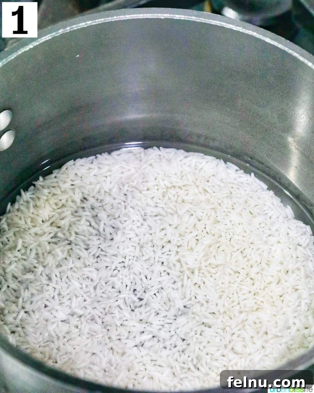 Shrimp and Chicken Stir-Fry Rice Bowl 5 Rice cooking in a pan