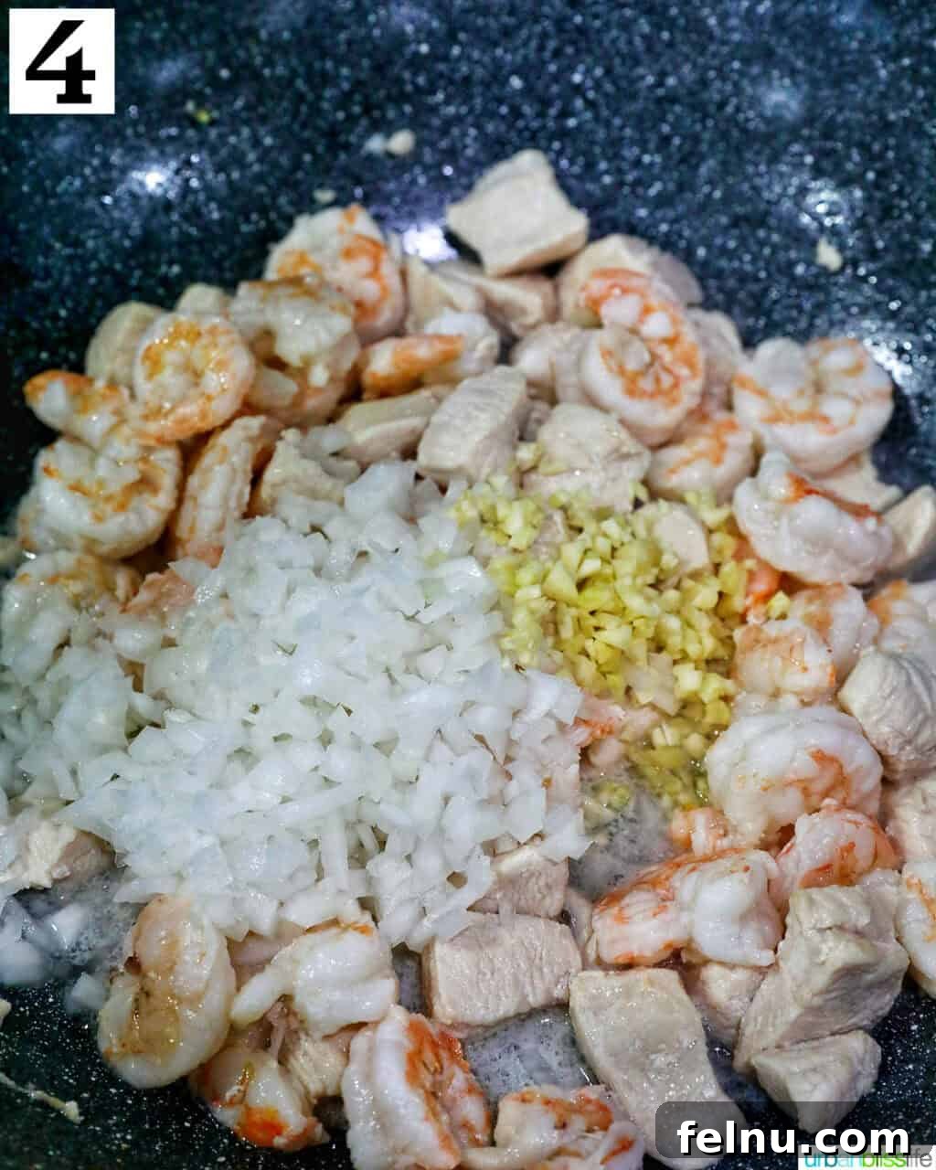 Shrimp and Chicken Stir-Fry Rice Bowl 9 Onions and garlic with chicken in a wok