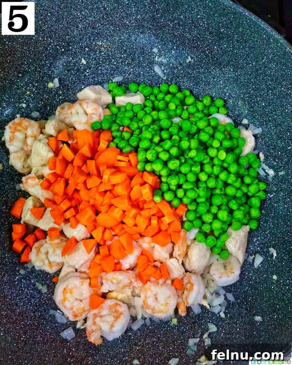 Shrimp and Chicken Stir-Fry Rice Bowl 10 Carrots and peas added to the wok