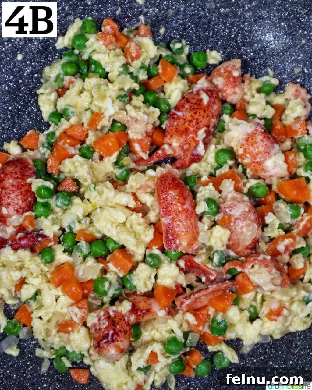 Decadent Lobster Fried Rice 11 wok with lobster fried rice ingredients in it.