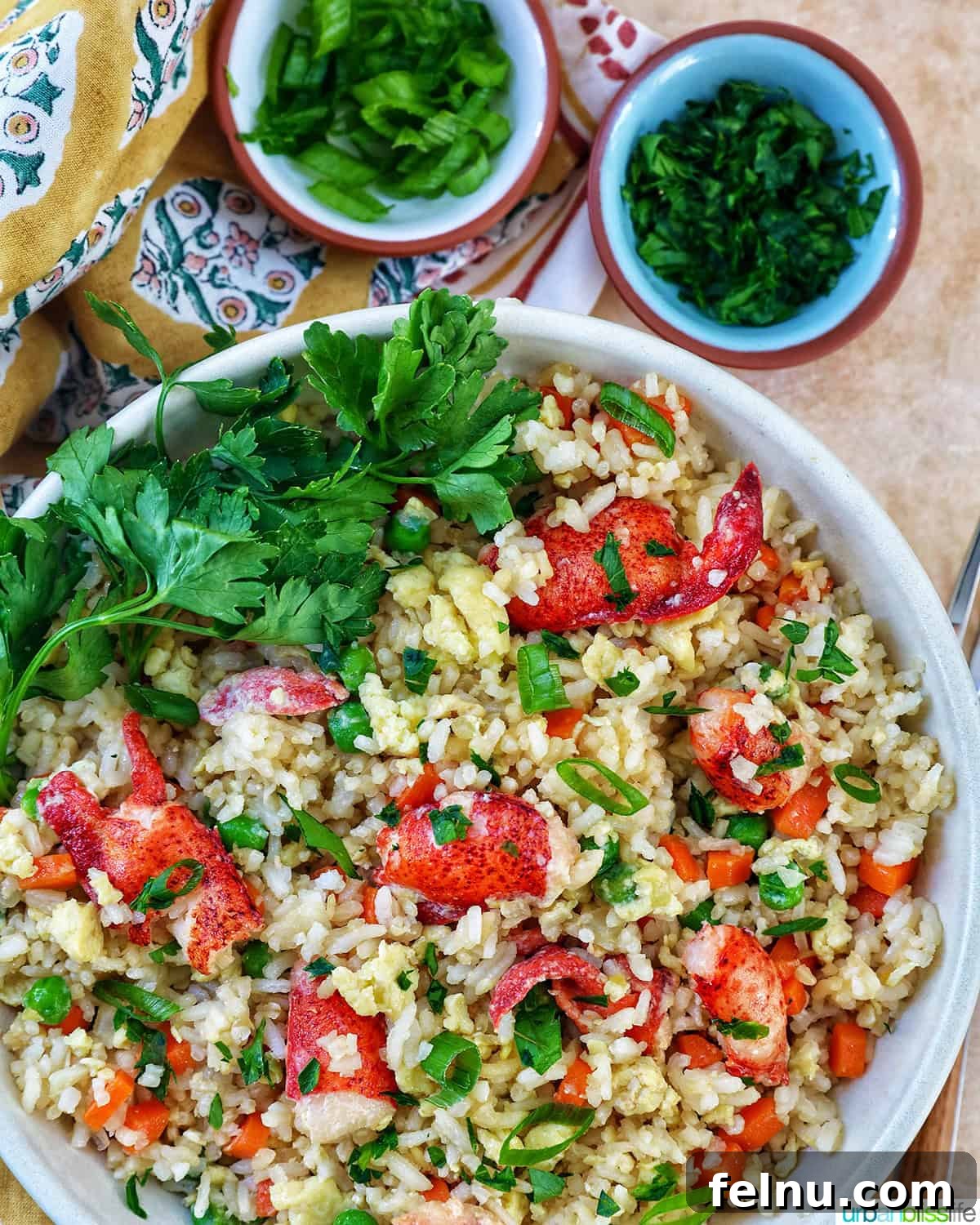 Decadent Lobster Fried Rice 17 bowl of lobster fried rice with bowls of fresh herbs.