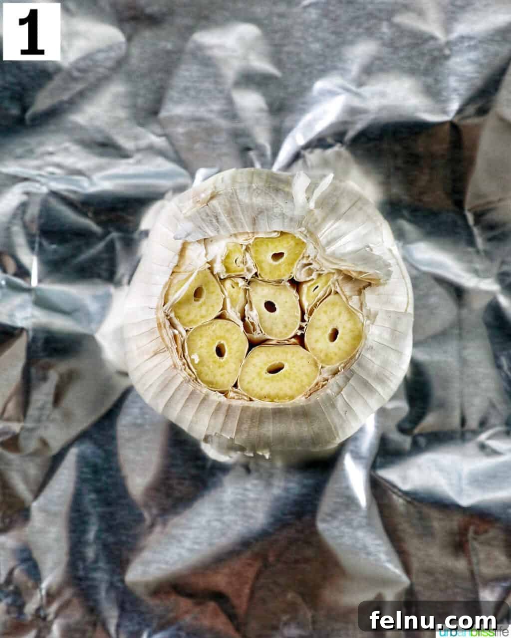 Golden Butternut Squash and Roasted Garlic Spread 5 garlic head on aluminum foil.