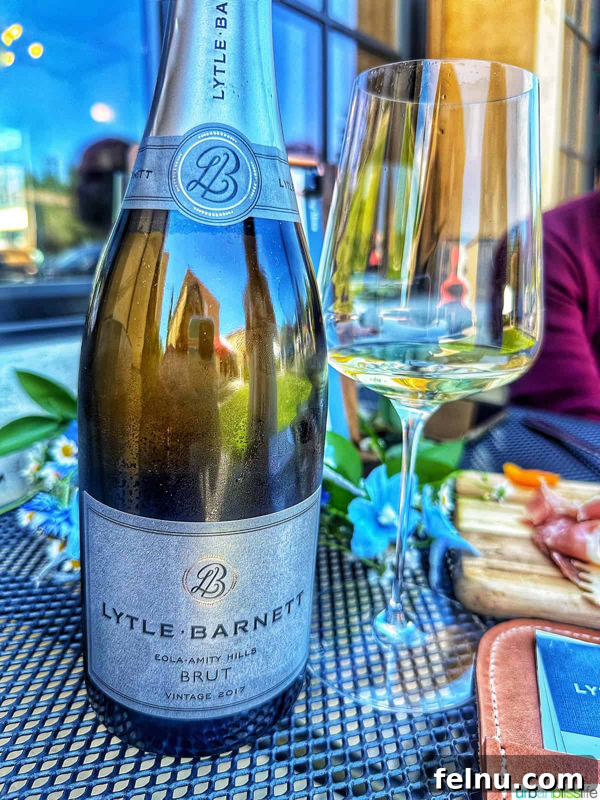 Lytle-Barnett & Aubaine Vintners Lounge 5 A close-up of a Lytle-Barnett Brut sparkling wine bottle, highlighting its elegant label and fine craftsmanship.
