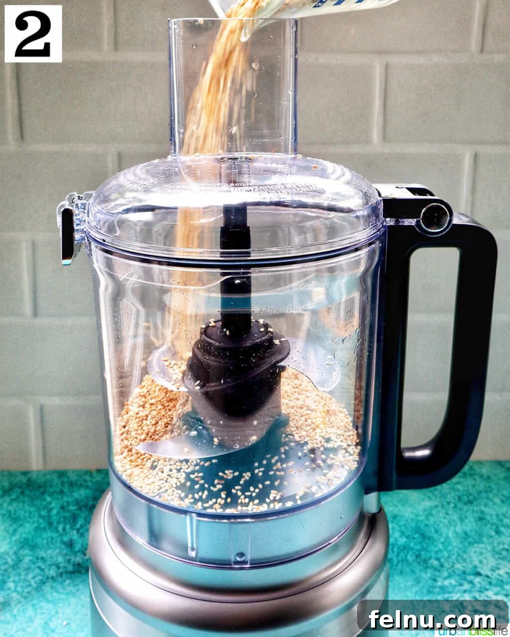 Crafting Your Own Tahini 7 food processor with sesame seeds.